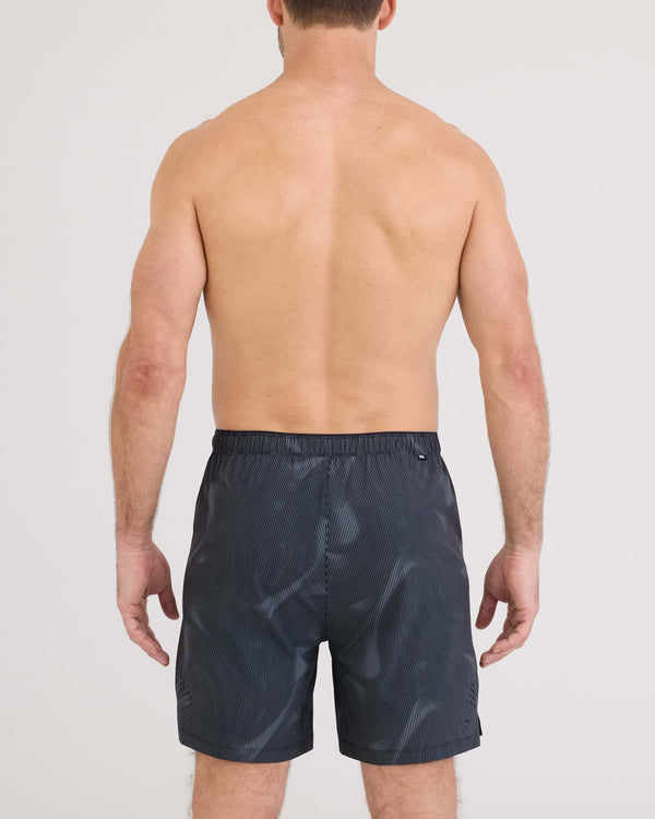 Back - Model wearing Power Moves 2N1 Short 7" in Smoke Camo-Dark Charcoal