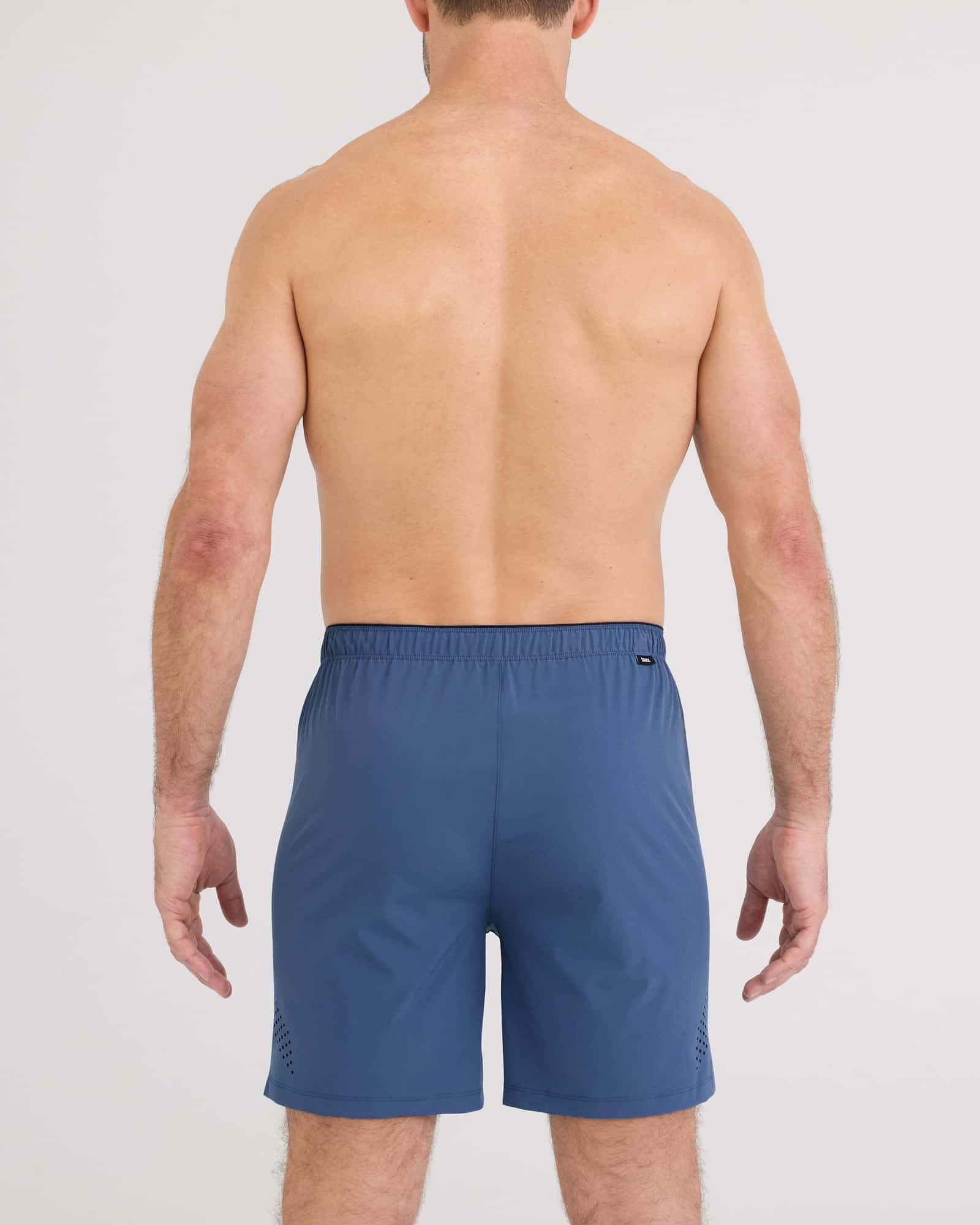 Back - Model wearing Power Moves Short 7" in Washed Indigo