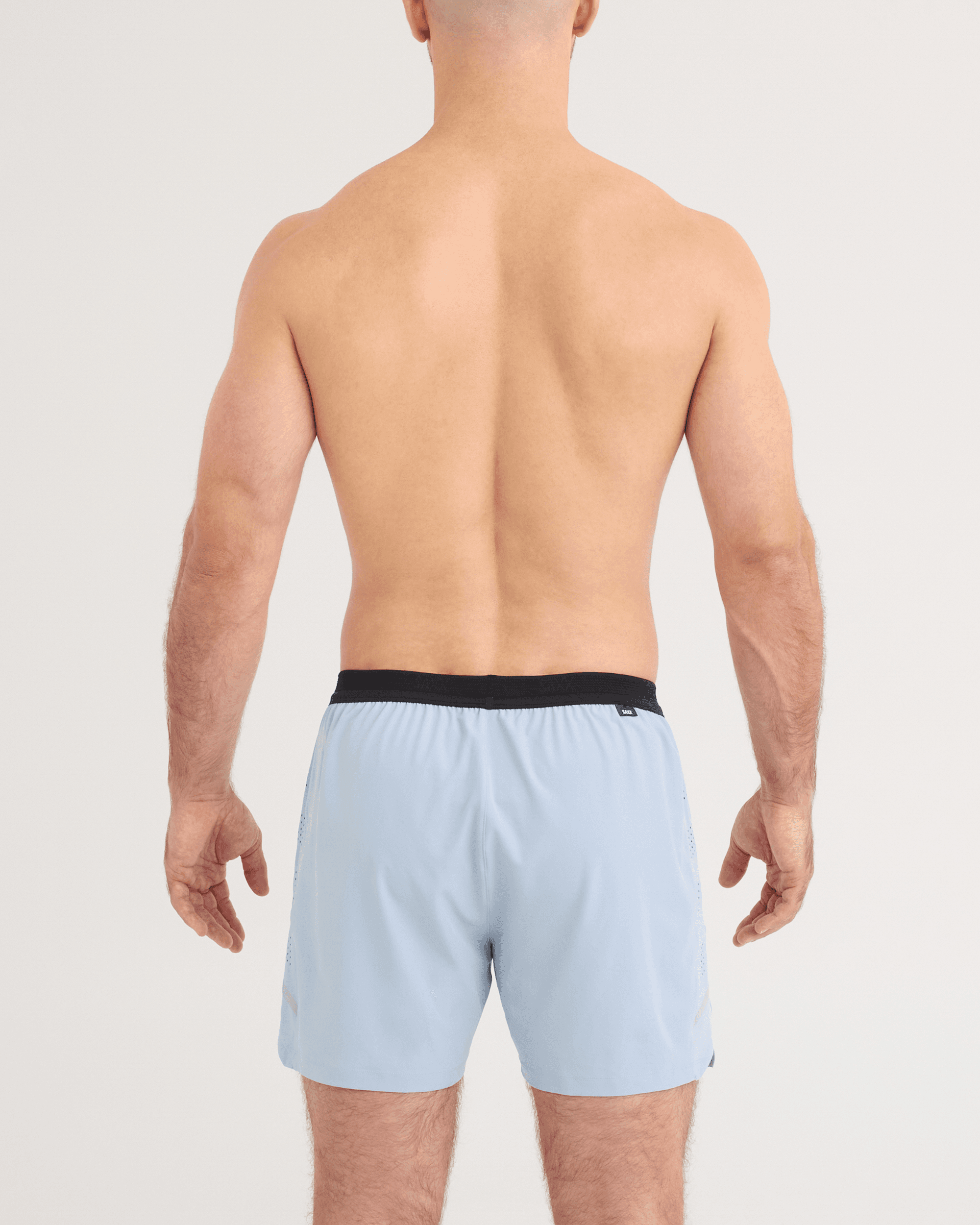 Back - Model wearing Run for All 2N1 Shorts 5" in Blue Fog