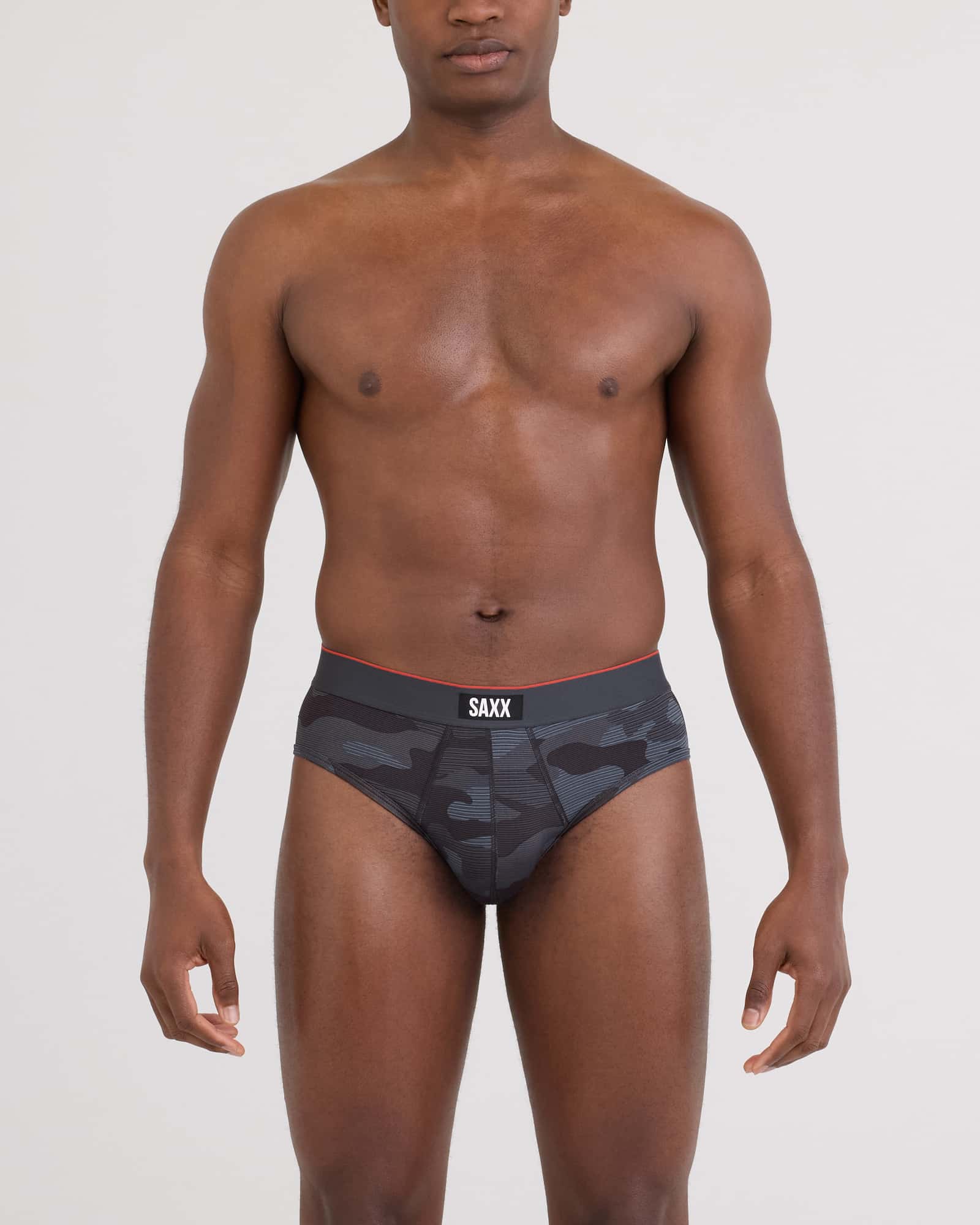 Front - Model wearing Multi-Sport Mesh Brief in Remote Camo - Faded Black