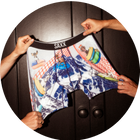 Outdoor Boxer Briefs in a wintery print being held by four hands