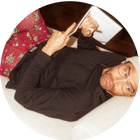 Man wearing black long sleeve tee and red Boxer Briefs while writing in journal