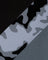 Camouflage pattern with black and gray colors on a textured background