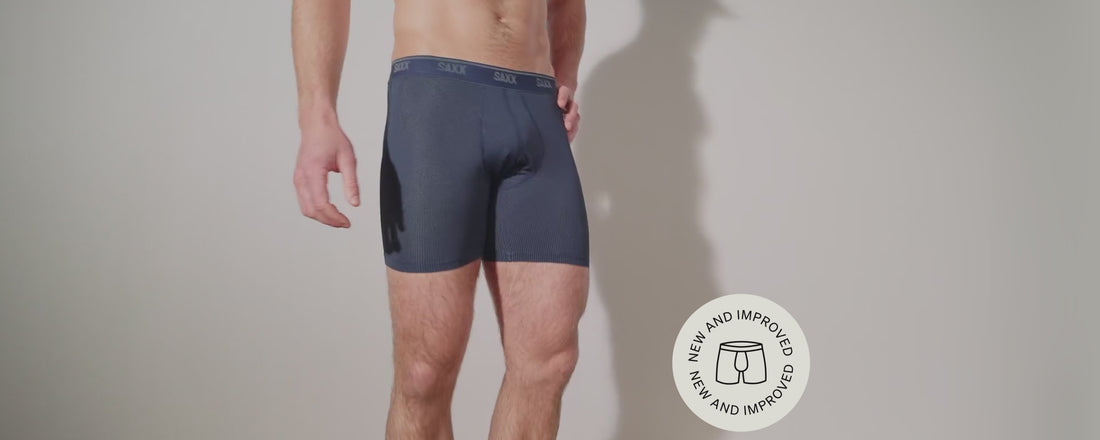 A mode wearing SAXX Underwear Quest Quick-Dry Mesh Boxer Brief.