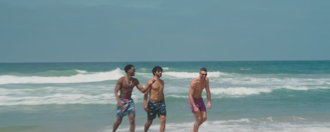 Men enjoying the beach, wearing SAXX Swim Shorts