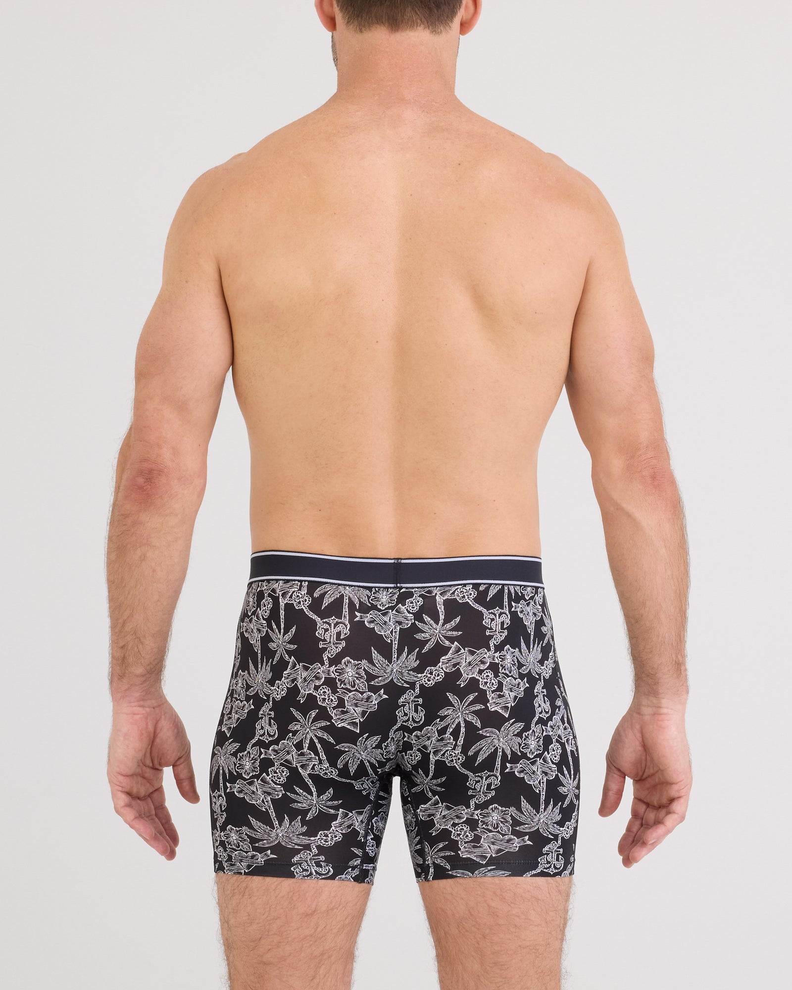 Back - Model wearing  Daytripper Comfort Stretch Boxer Brief Fly in Tropical Tattoo-Black