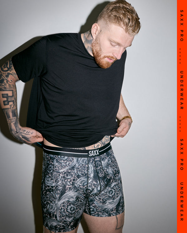 SAXX Gamechanger and Pro Fooball Player Maxx Crosby wearing Volt Breathable Mesh Boxer Brief in Fleur De League-Black
