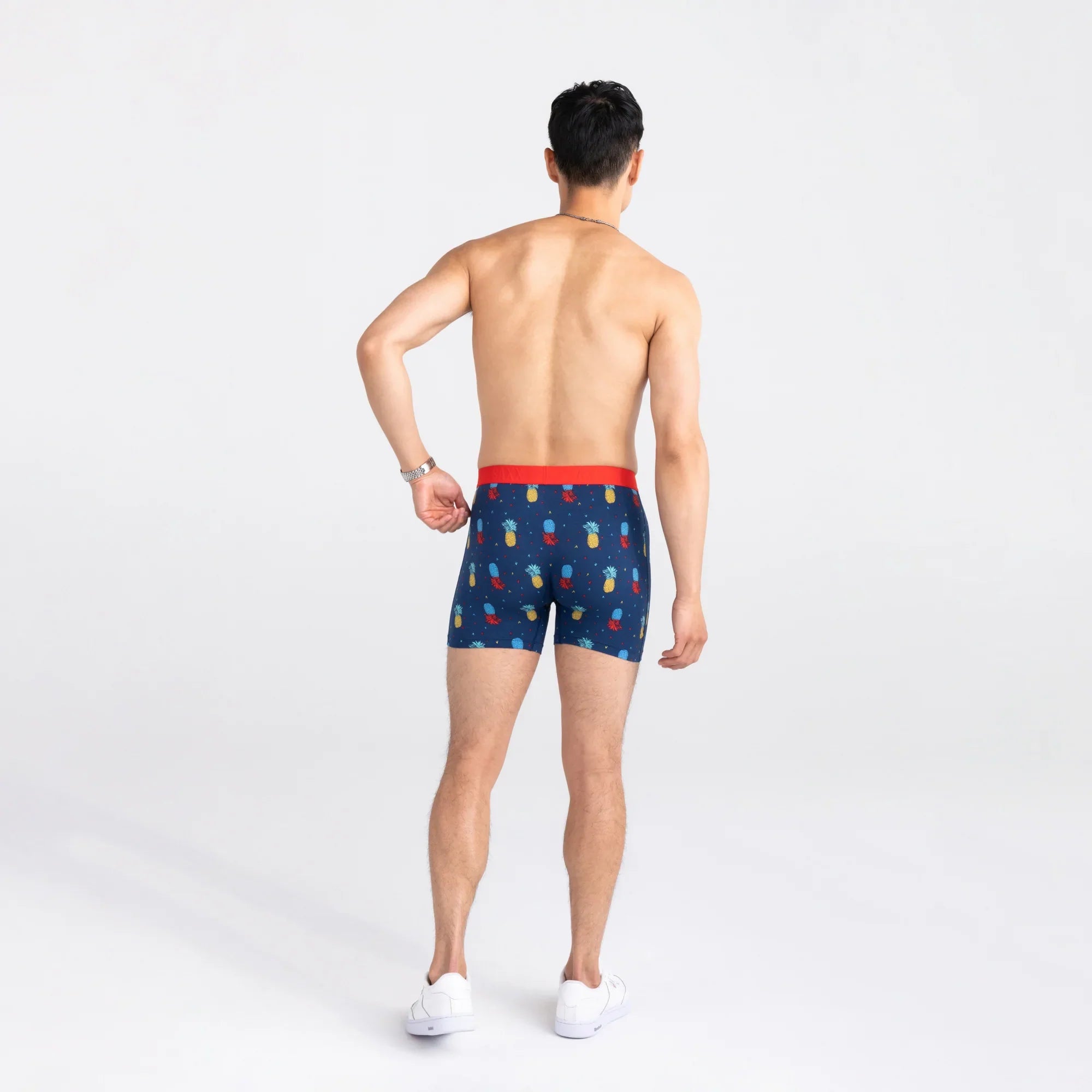 Back - Model wearing Ultra Super Soft Boxer Brief Fly in Pineapple Flip- Navy