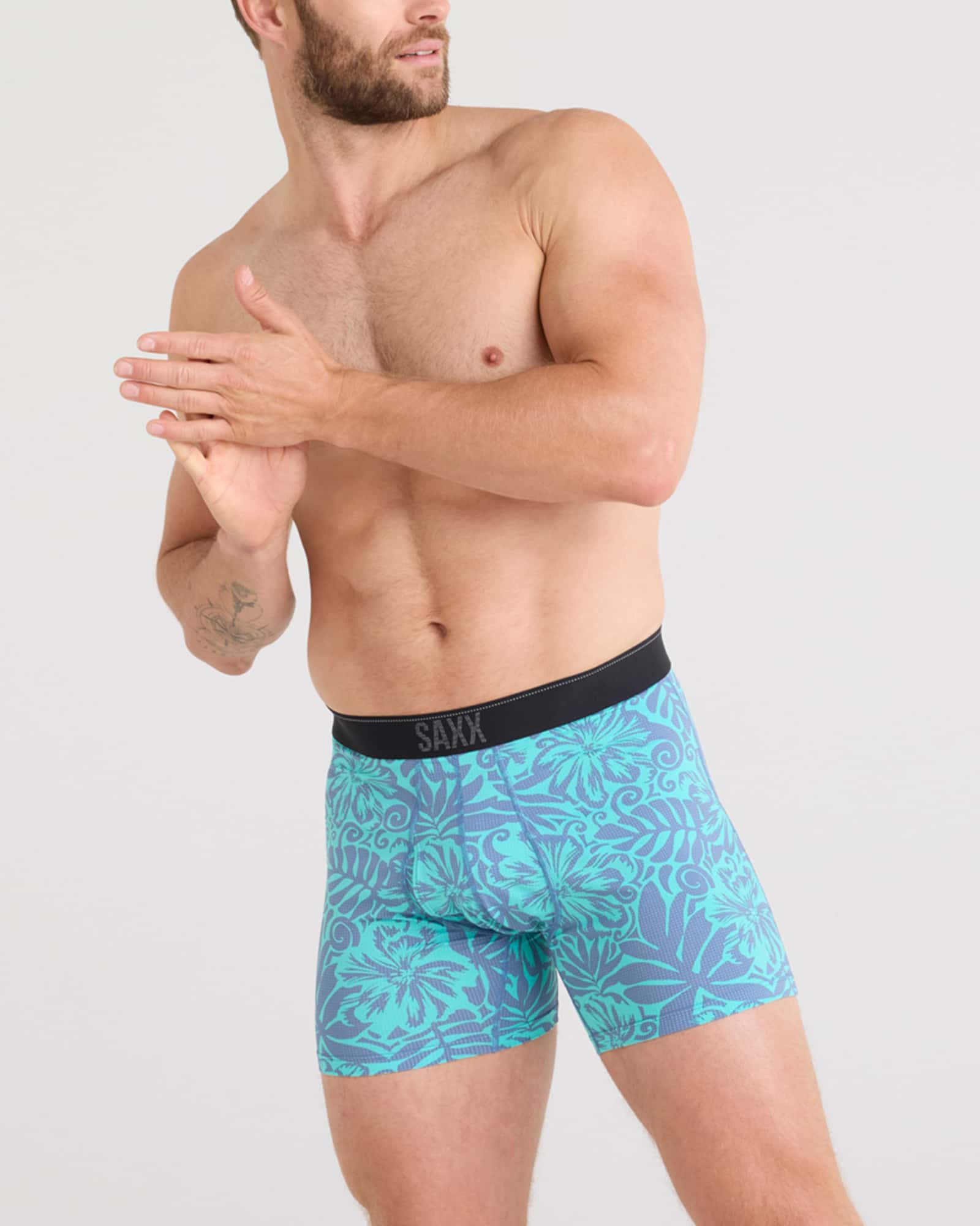 Front - Model wearing Quest Quick Dry Mesh Baselayer Boxer Brief Fly in Surf Flowers-Turquoise