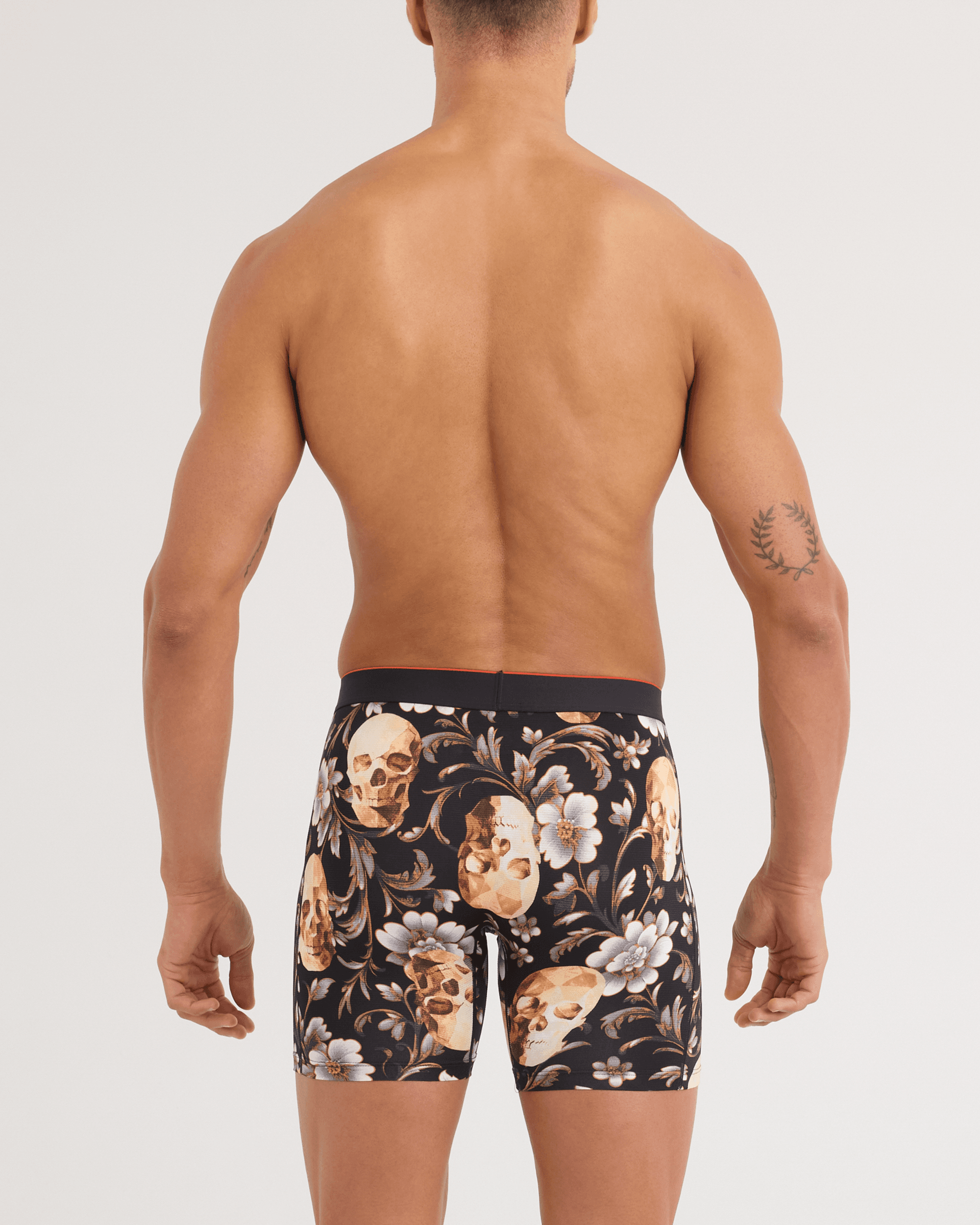 Back - Model wearing Multi-Sport Mesh Boxer Brief in Gold Skull-Black