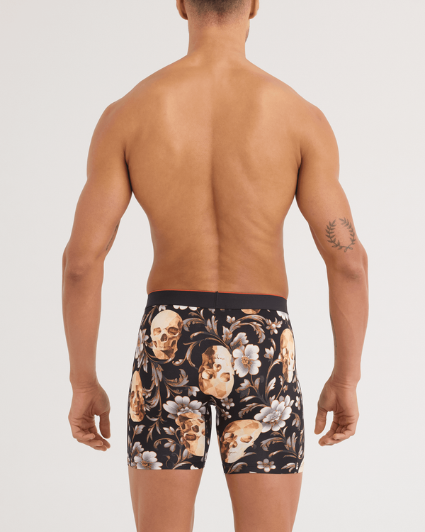 Back - Model wearing Multi-Sport Mesh Boxer Brief in Gold Skull-Black