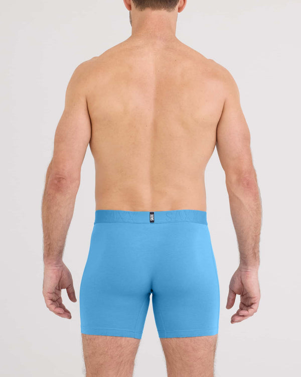 Back - Model wearing Droptemp Cooling Cotton Boxer Brief Fly in Parisian Blue