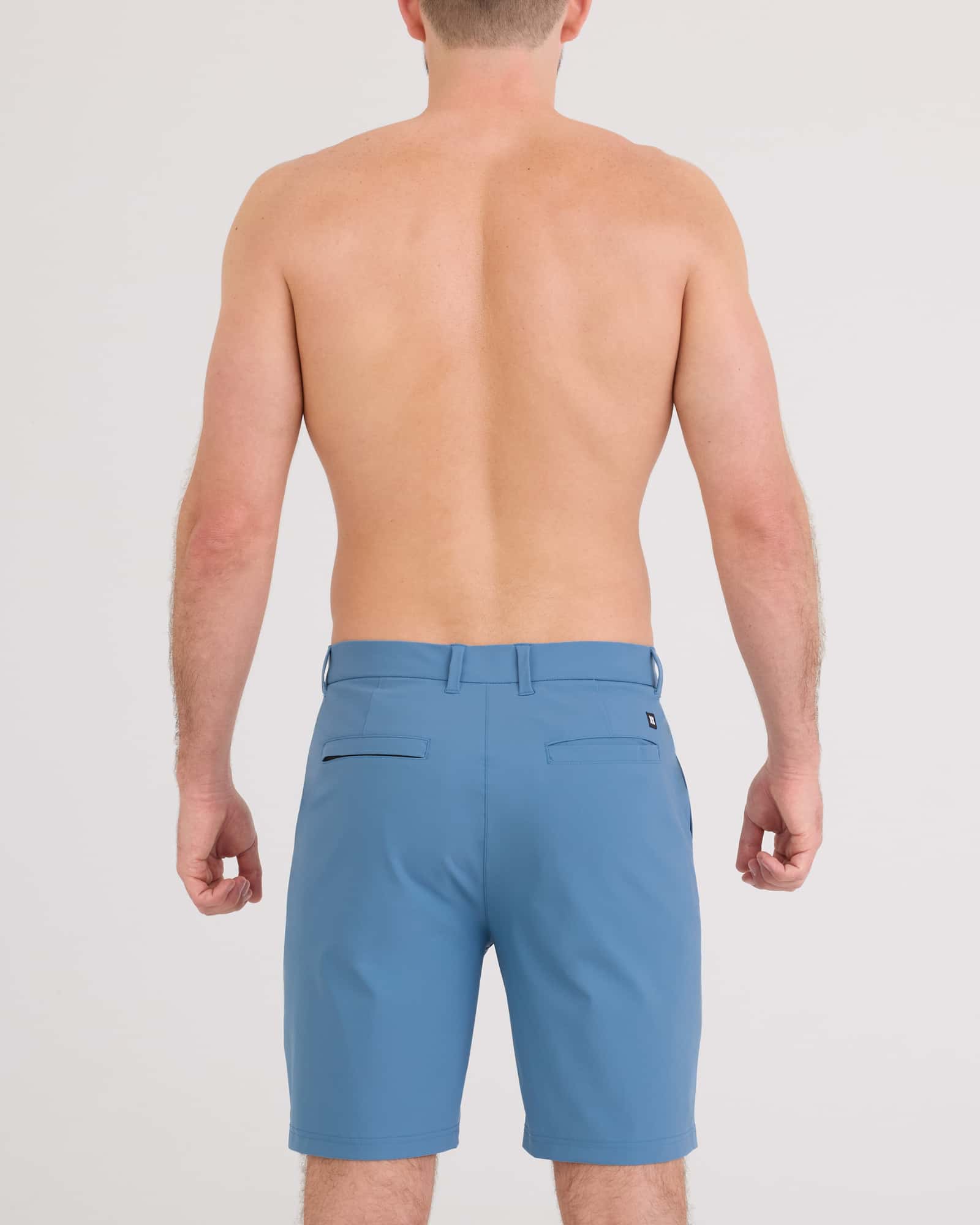 Back - Model wearing Caddie Short 8" in Slate