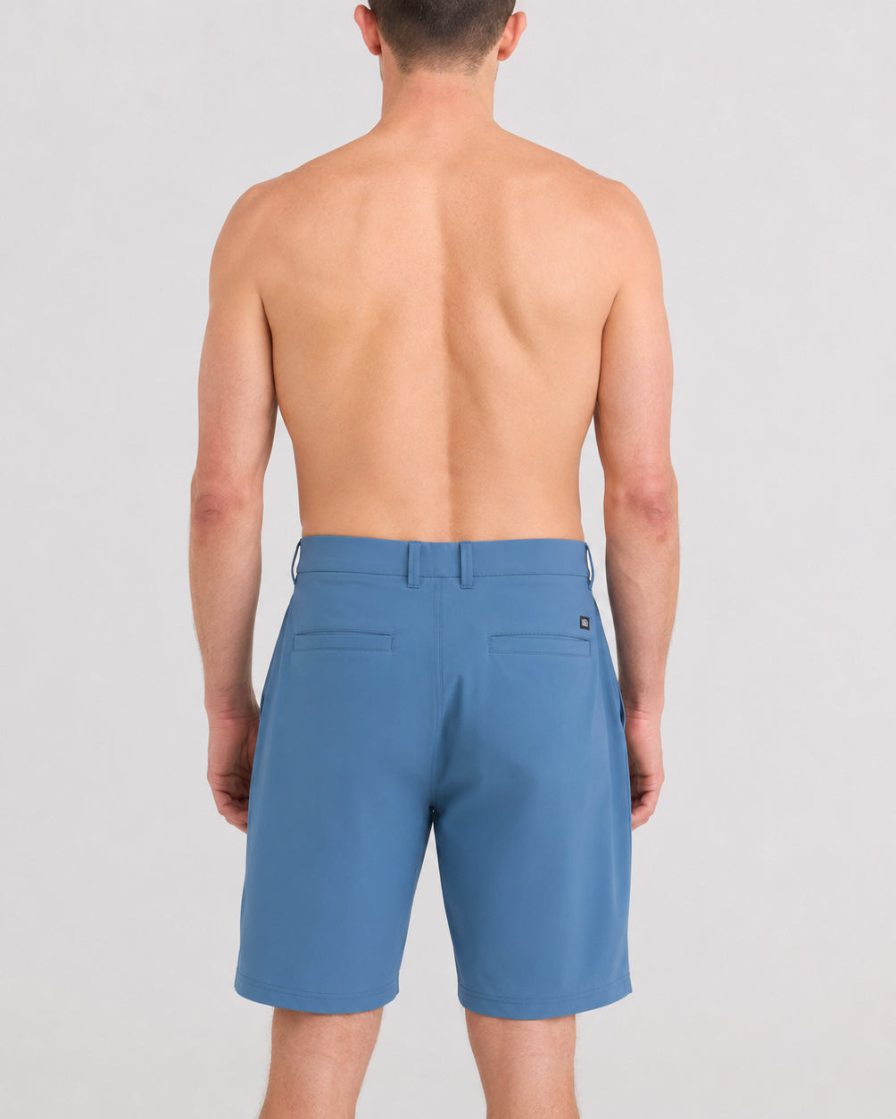 Back - Model wearing Caddie Short 8" in Slate