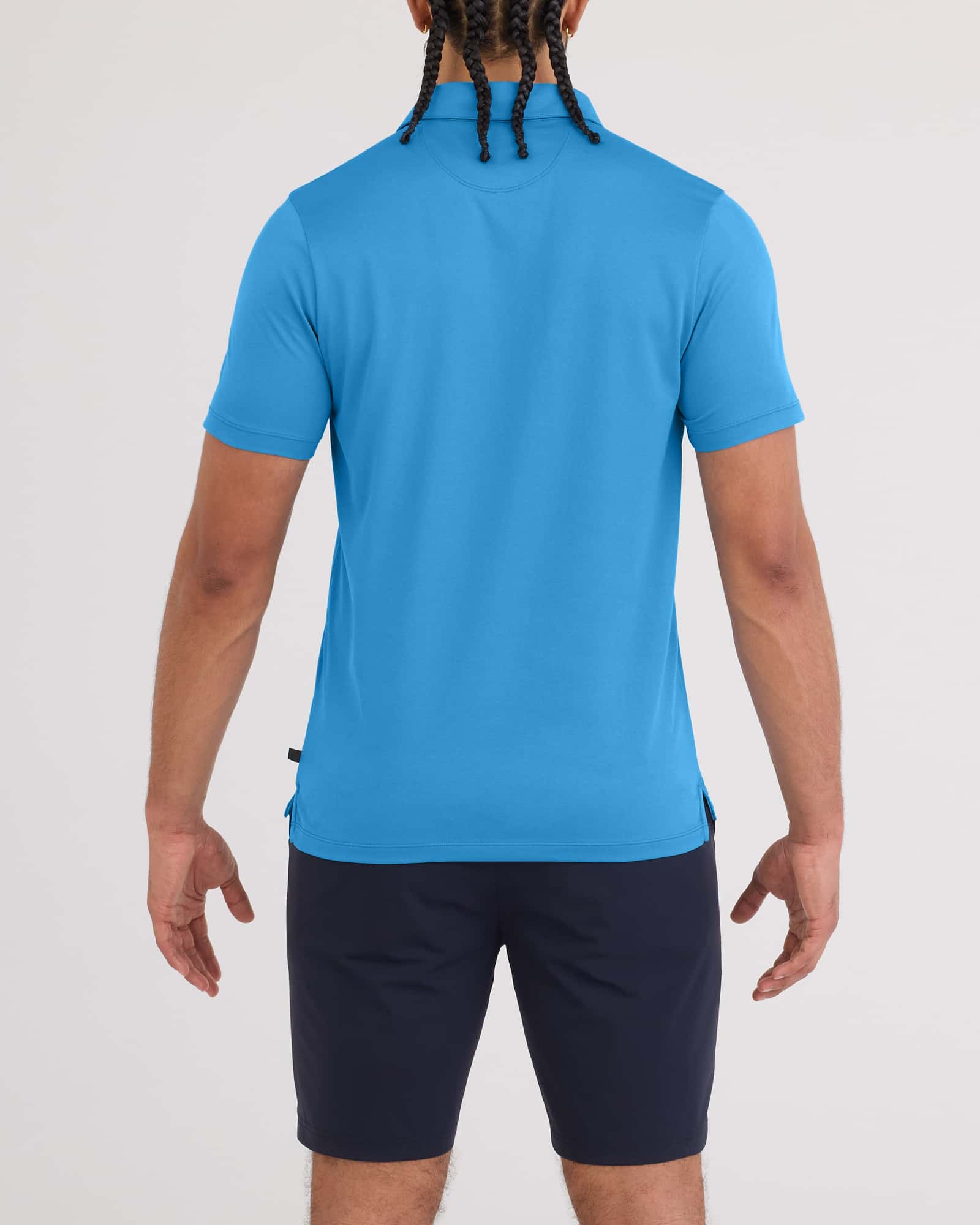 Back - Model wearing Droptemp Dry Polo in Parisian Blue
