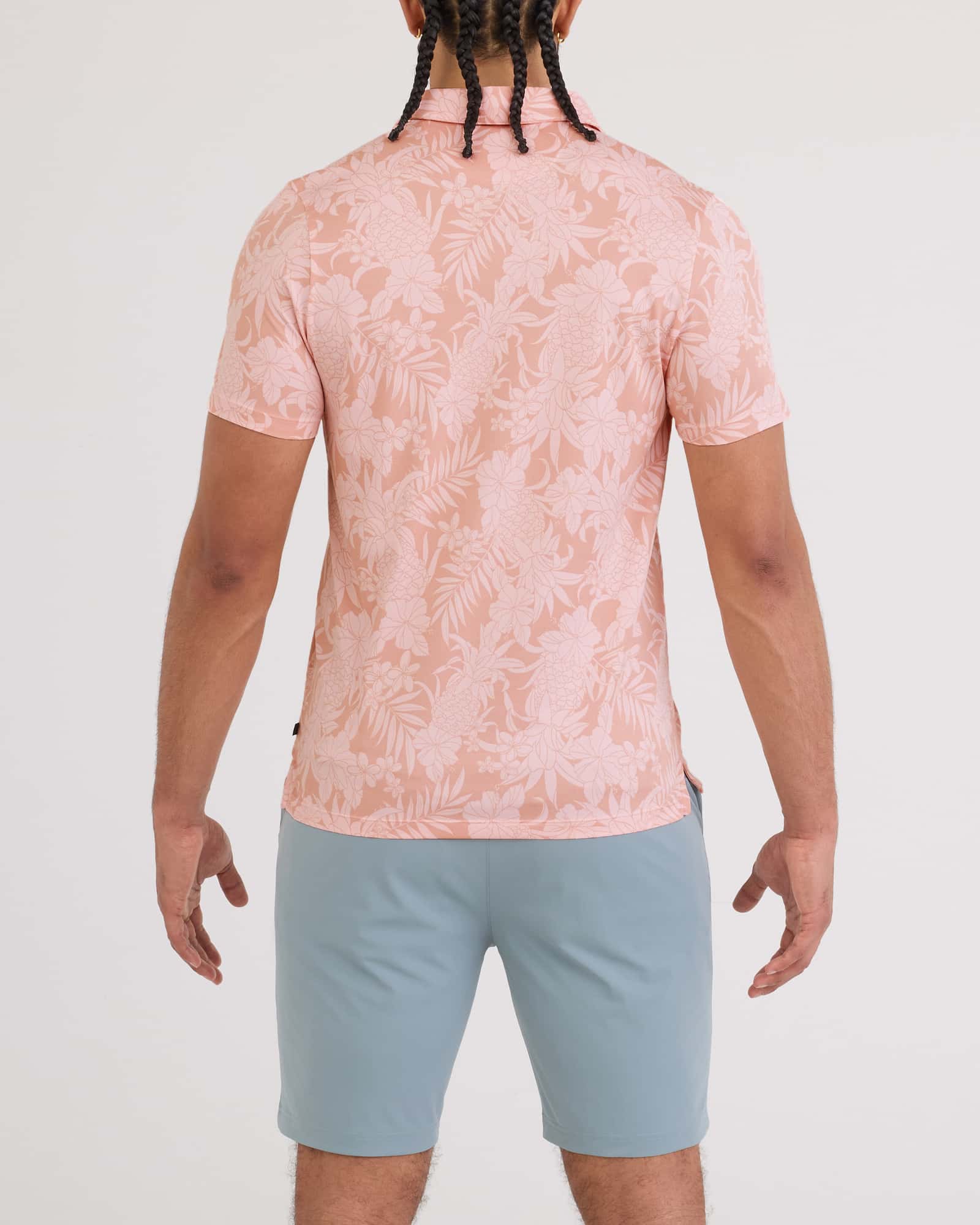 Back - Model wearing Droptemp Dry Polo in Pineapple Tonal-Light Coral