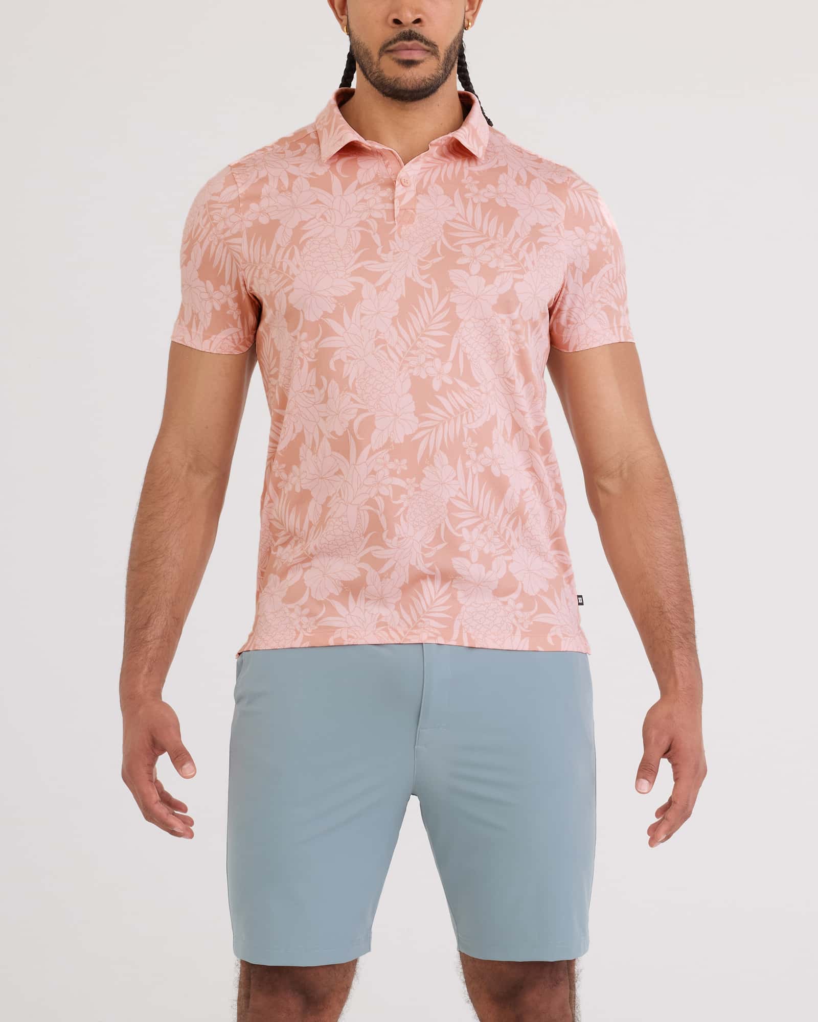 Front - Model wearing Droptemp Dry Polo in Pineapple Tonal-Light Coral