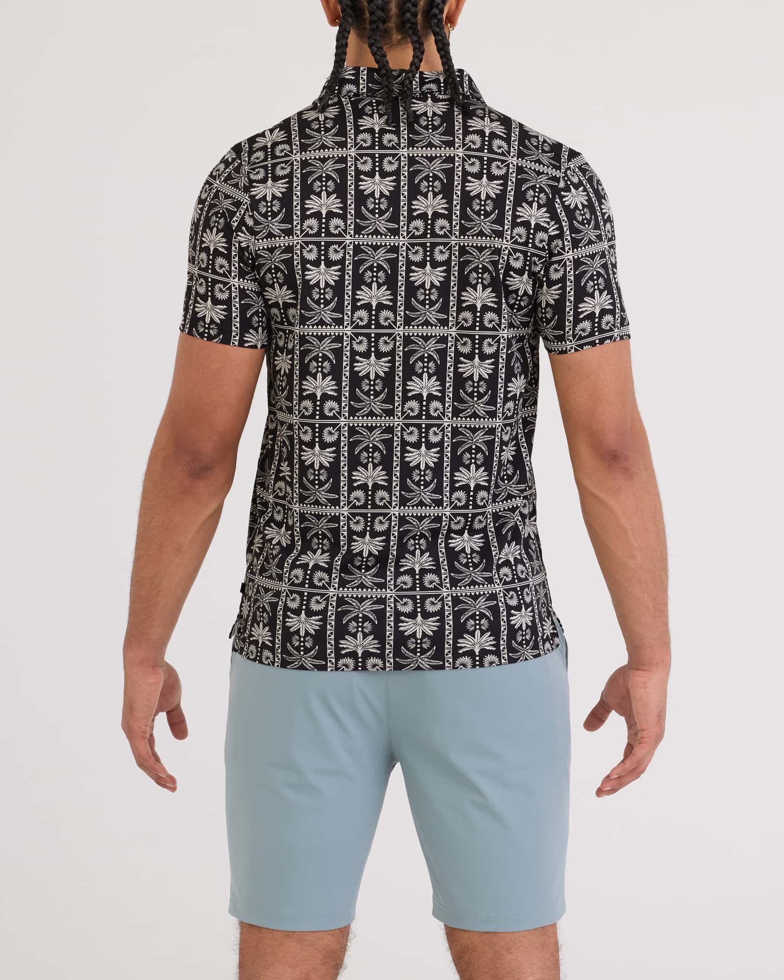 Back - Model wearing Droptemp Dry Polo in Tropic Royale-Black