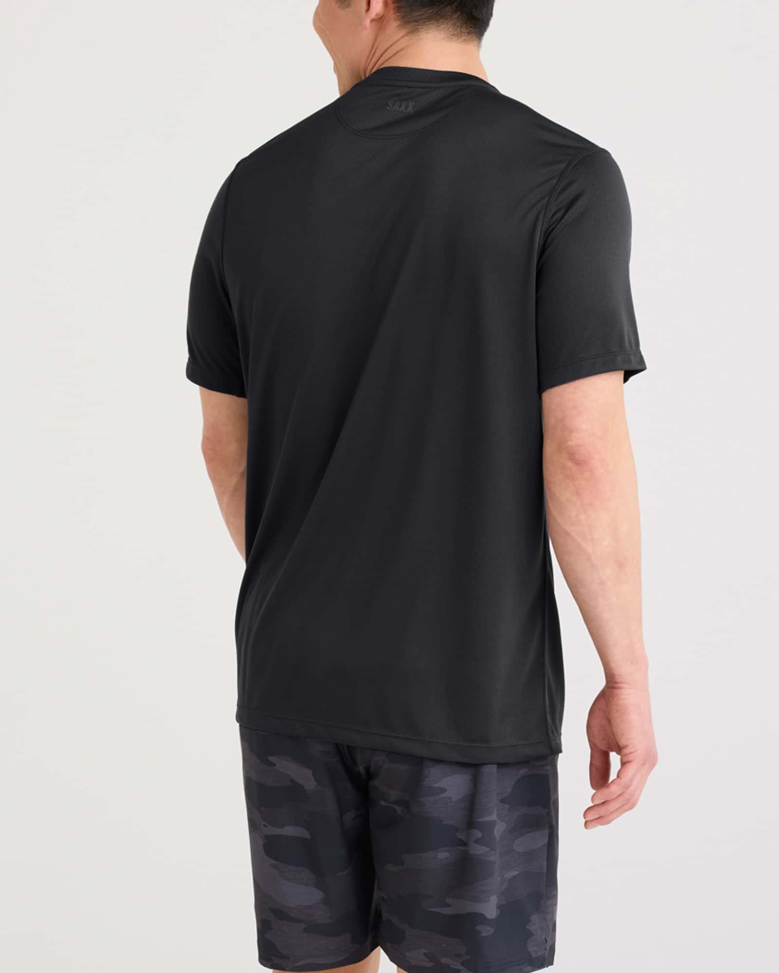Back - Model wearing Multi-Sport Tech Tee in Faded Black