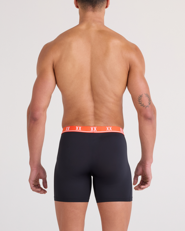 Back - Model wearing Essential Performance Mesh Boxer Brief in Black-Vermillion WB