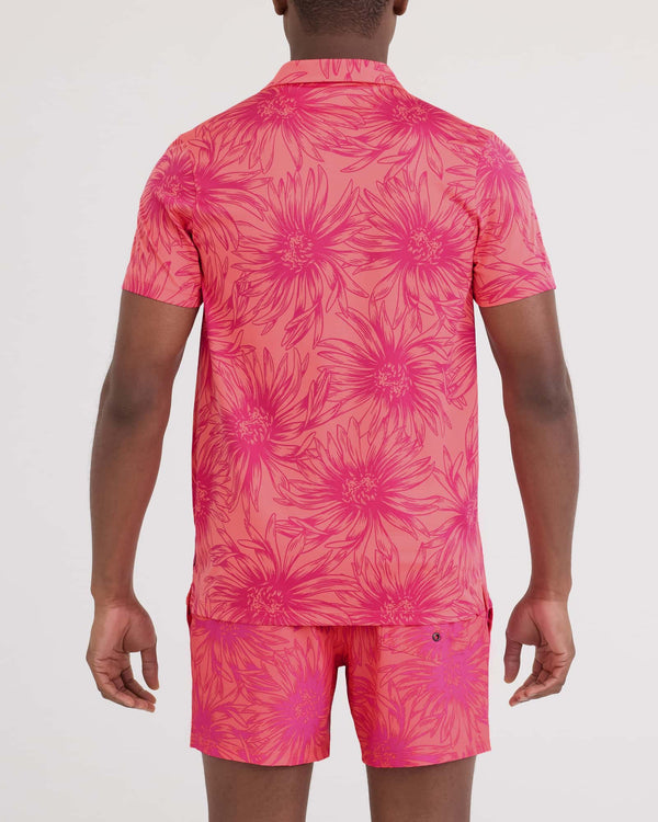 Back - Model wearing Droptemp Dry Resort Polo in Big Daisy-Gumball