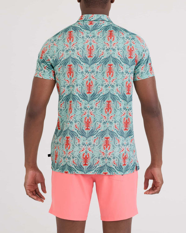 Back - Model wearing Droptemp Dry Resort Polo in Lobster Flourish-Mint
