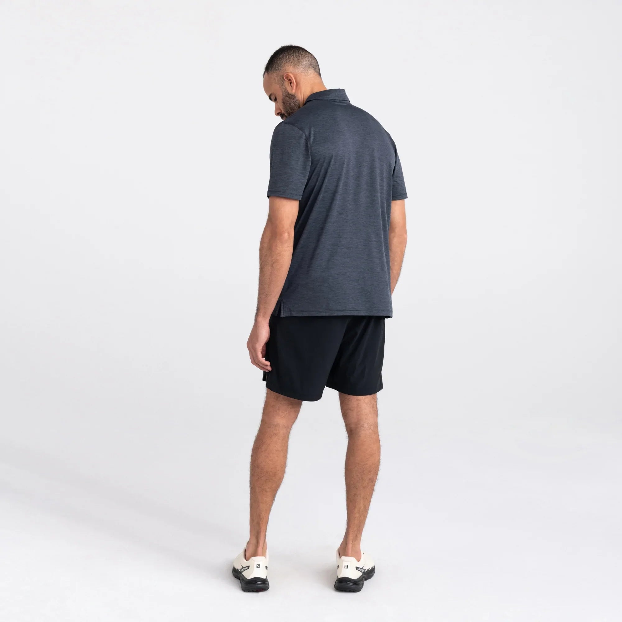 Back - Model wearing Droptemp All Day Cooling  Polo in Turbulence Heather