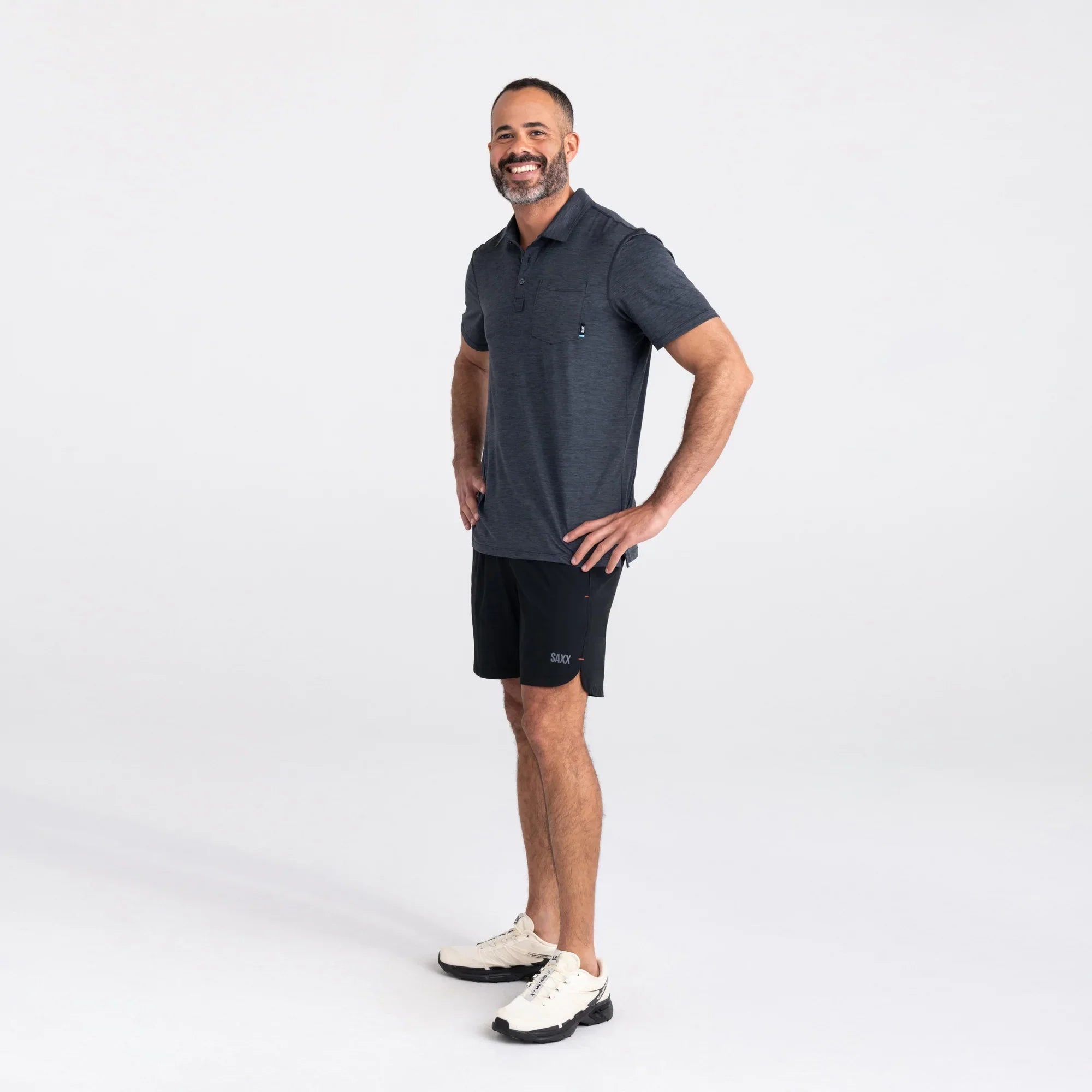 Front - Model wearing Droptemp All Day Cooling  Polo in Turbulence Heather