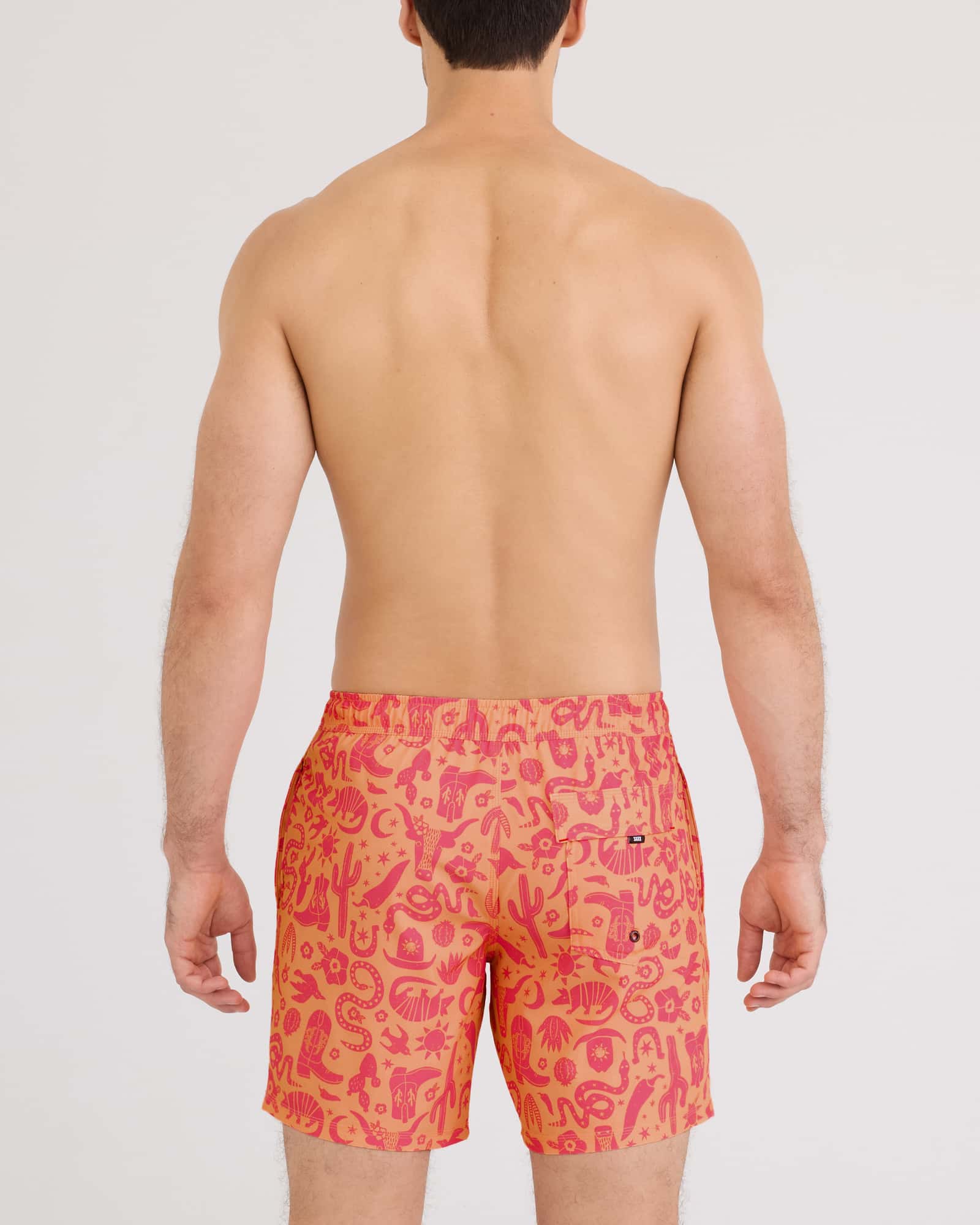 Back - Model wearing Oh Buoy 2N1 Volley 7" in Cactus Beach-Peach Jelly