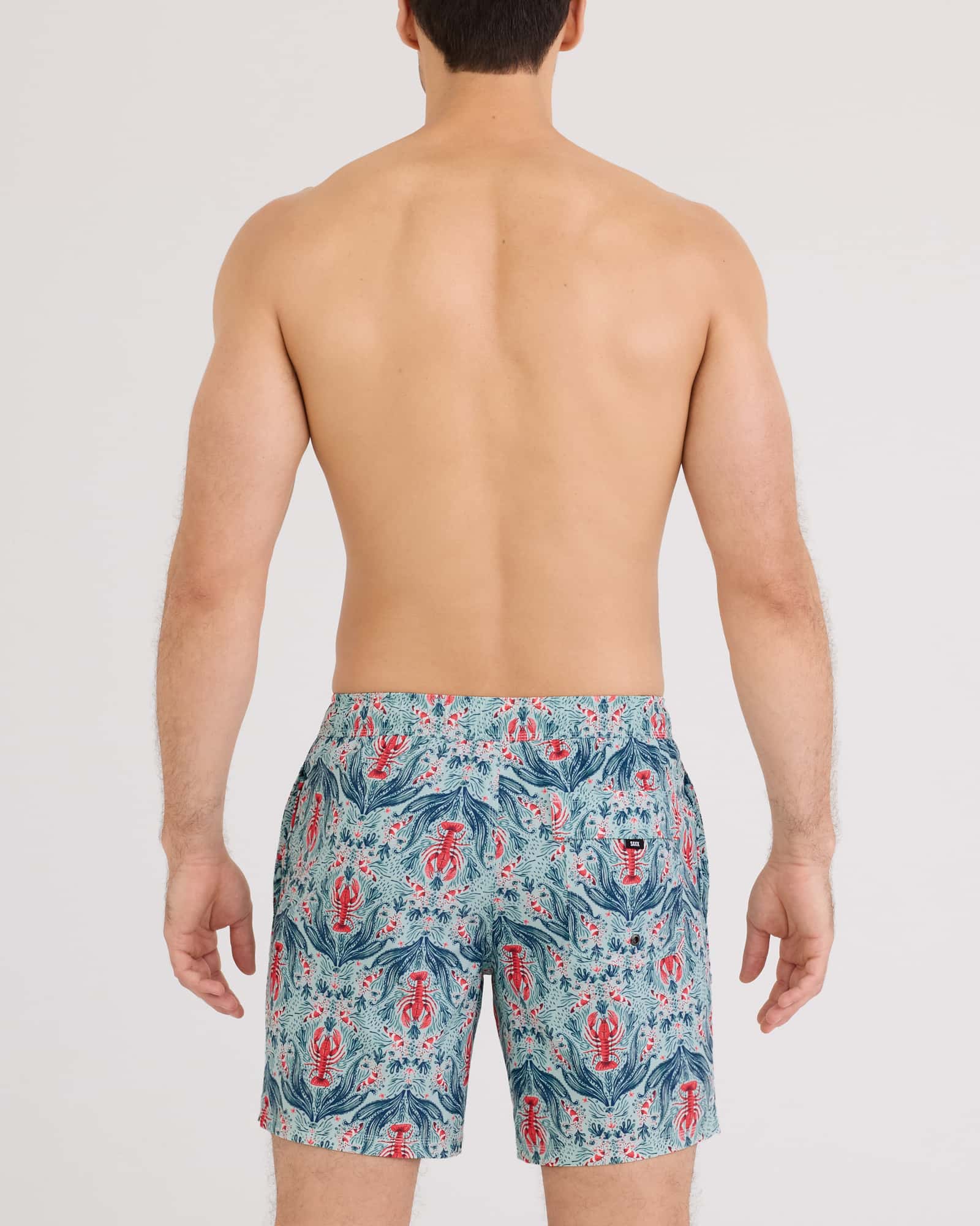 Back - Model wearing Oh Buoy 2N1 Volley 7" in Lobster Flourish-Mint