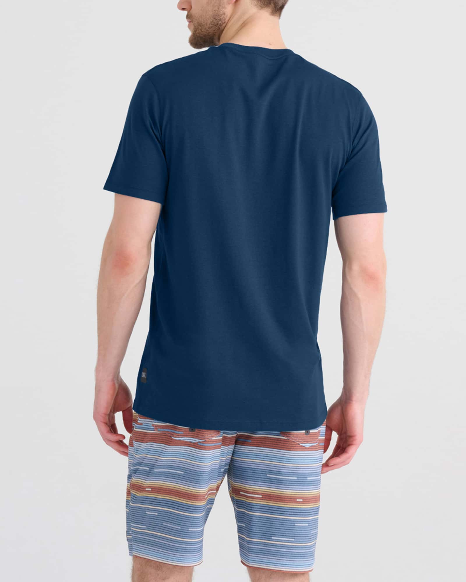 Back - Model wearing Droptemp Cooling Cotton Tee in Dark Denim