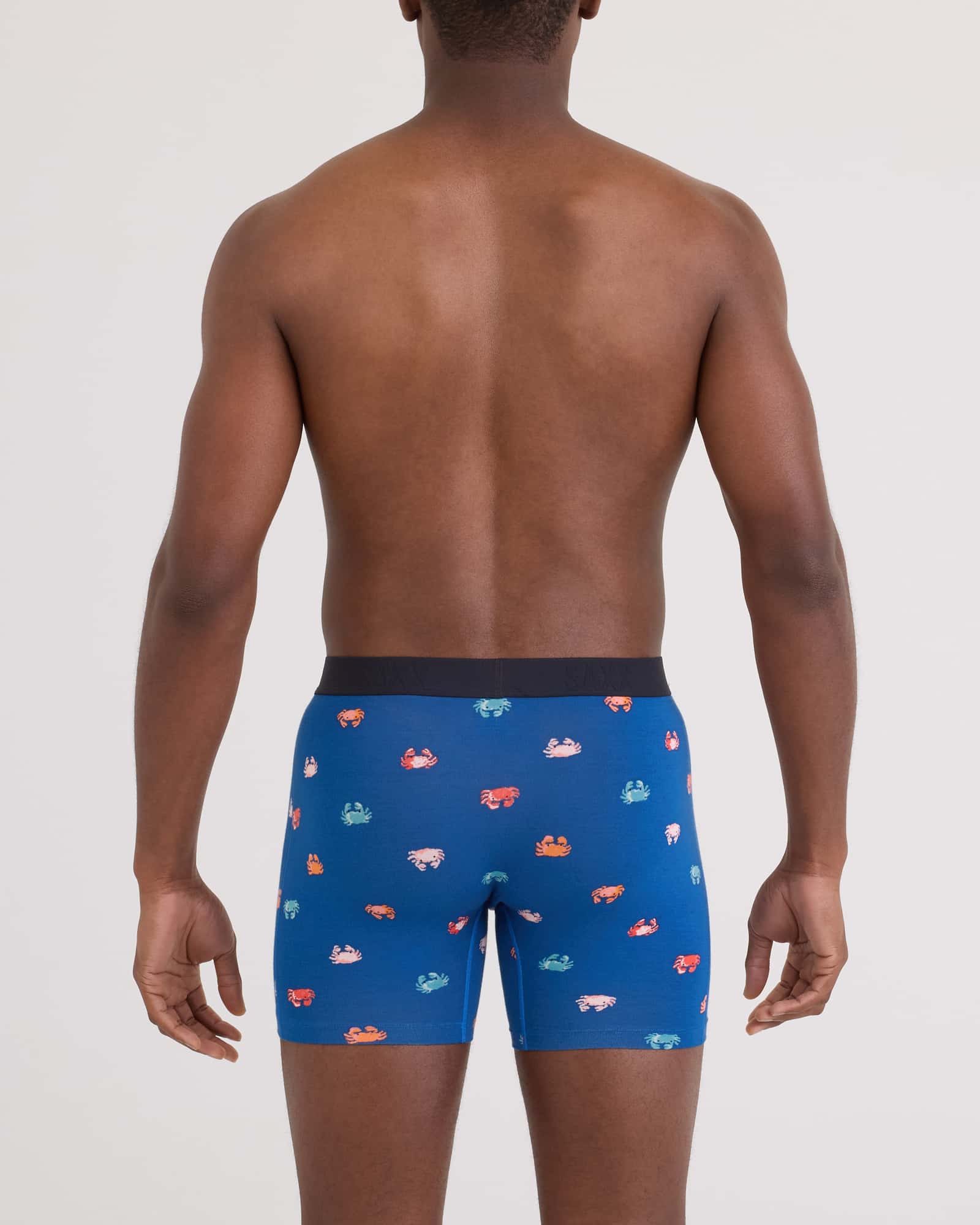 Back - Model wearing Vibe Xtra Soft Comfort Boxer Brief Fly in Crab Boil-Navy Dawn
