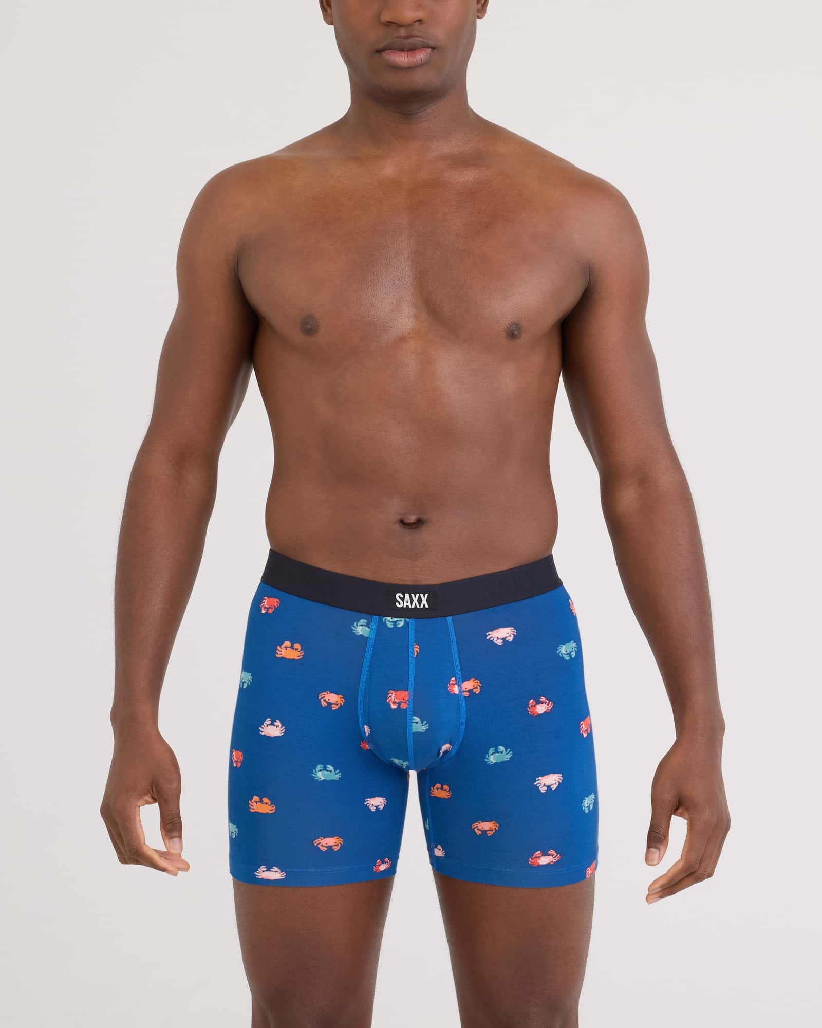 Front - Model wearing Vibe Xtra Soft Comfort Boxer Brief Fly in Crab Boil-Navy Dawn