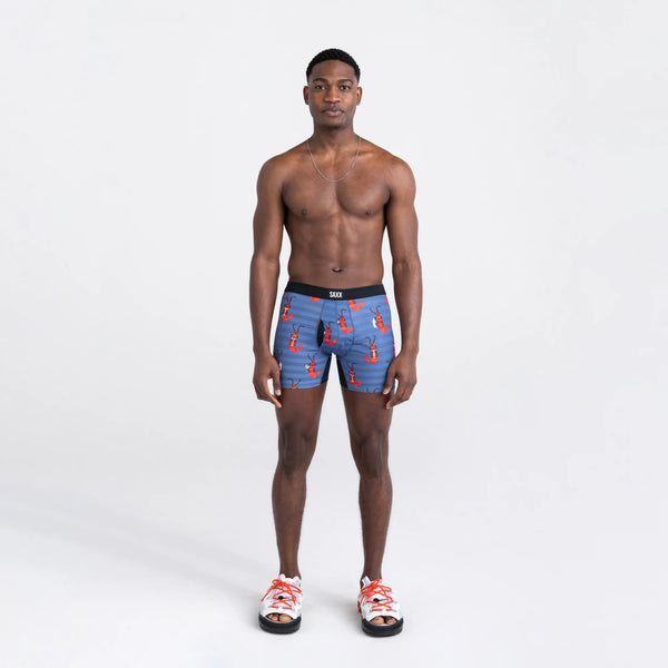 Front - Model wearing Droptemp Cooling Mesh Boxer Brief Fly in Shrimp Cocktail- Navy