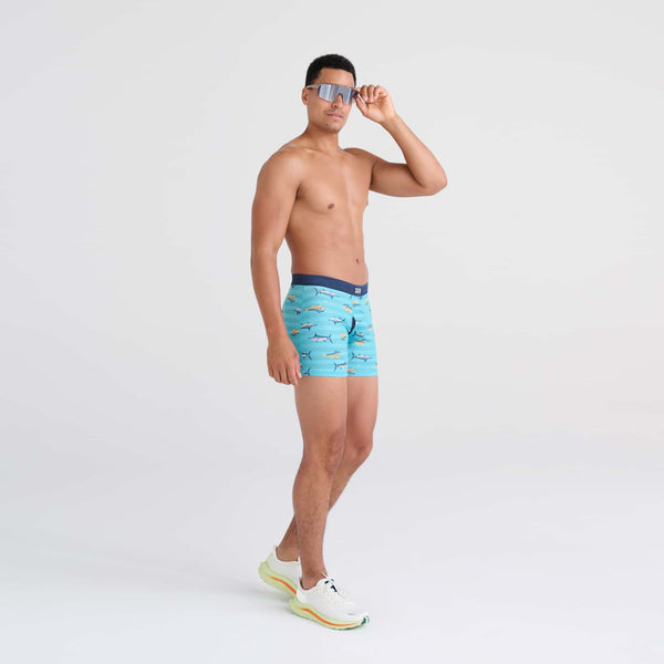Front - Model wearing DropTemp Cooling Mesh Boxer Brief in Trophy Catch- Turquoise