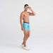 Front - Model wearing DropTemp Cooling Mesh Boxer Brief in Trophy Catch- Turquoise