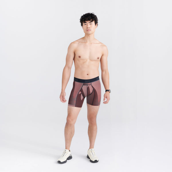 Front - Model wearing Kinetic Light-Compression Mesh Boxer Brief in Optic Mountain- Dark Brick