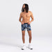 Front - Model wearing DropTemp Cooling Cotton Boxer Brief in Tidal Camo- Blue