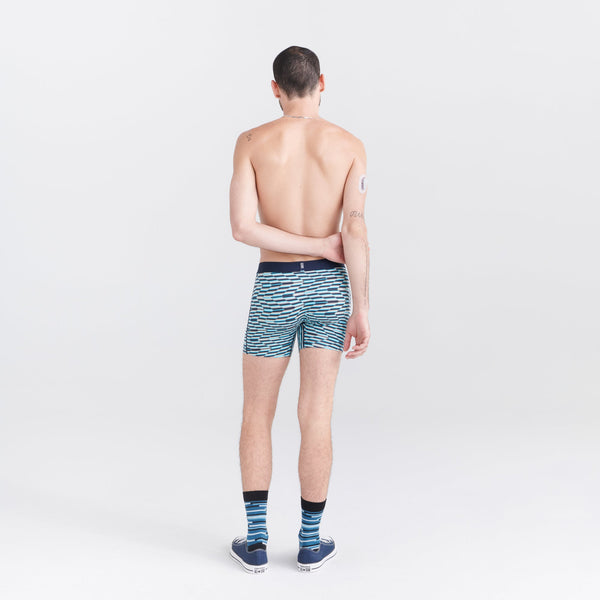 Back - Model wearing Droptemp Cooling Cotton Boxer Brief Fly in Zig Zag Stripe- Multi