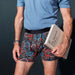 Model posing in 22nd Century Silk Boxer Brief Fly in Painted Paisley- Multi