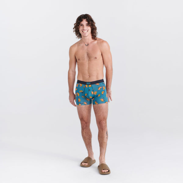 Front - Model wearing Vibe Super Soft Boxer Brief in Tailgaters- Teal