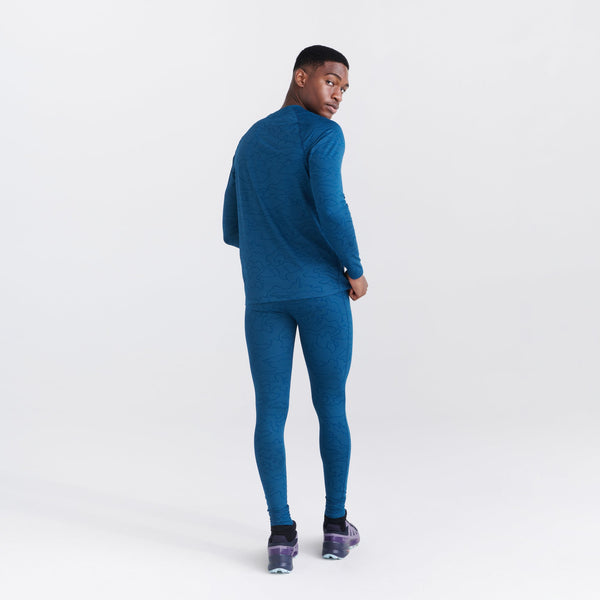 Back - Model wearing Quest Quick Dry Mesh Baselayer Long Sleeve Crew in Camo Jacquard- Teal