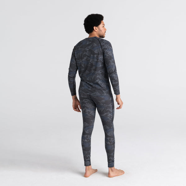 Back - Model wearing Quest Baselayer Long Sleeve Crew in Navy Mountainscape