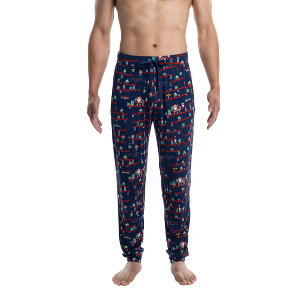 Front - Model wearing Snooze Sleep Pant in Santa's Workshop- Navy