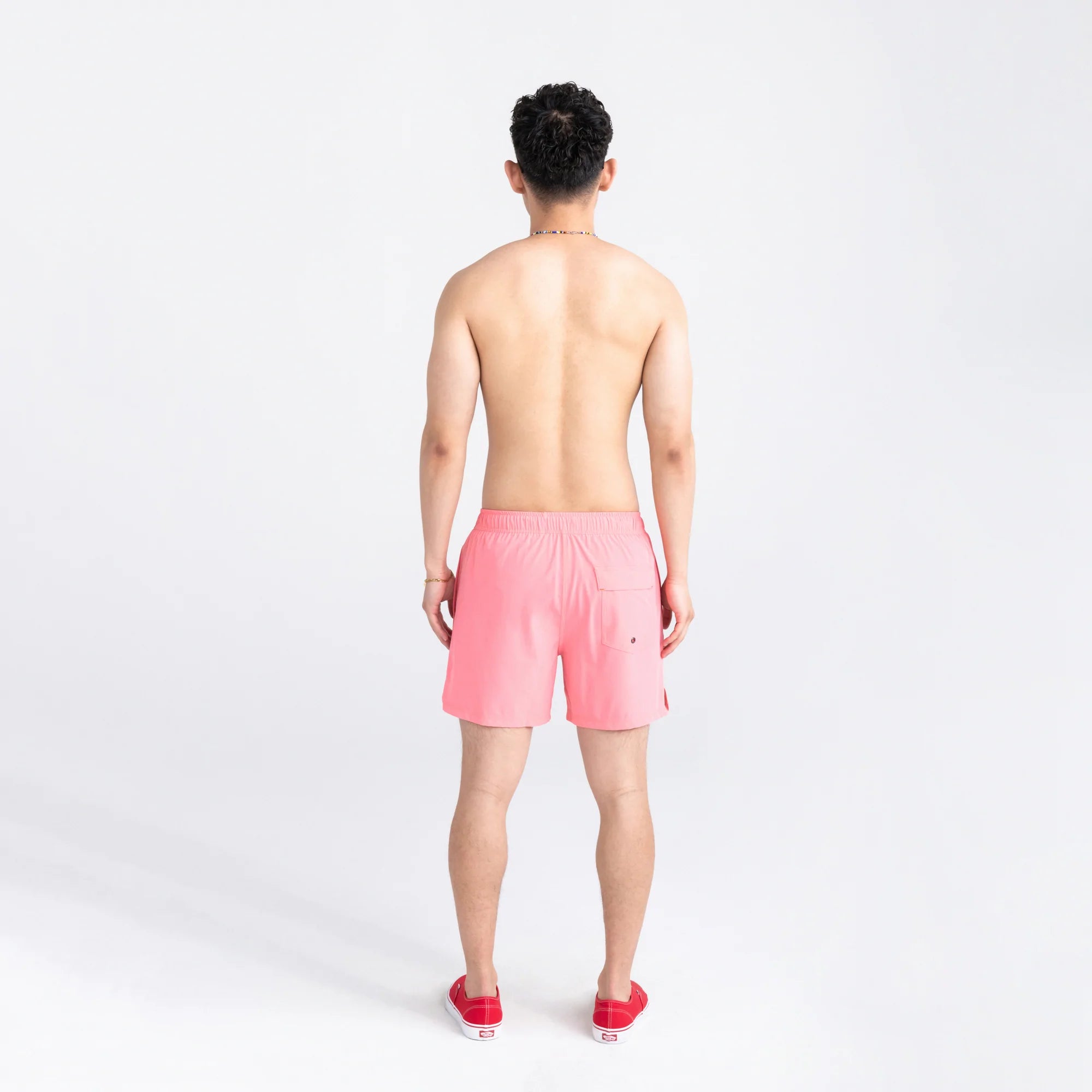 Back - Model wearing Oh Buoy 2N1 Swim Volley Short 5" in Flamingo
