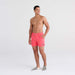 Front - Model wearing Oh Buoy 2N1 Swim Trunk 5" in Hibiscus