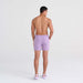 Back - Model wearing Oh Buoy 2N1 Swim Trunk 5" in Purple Haze