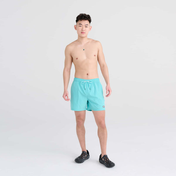 Front - Model wearing Oh Buoy 2N1 Swim Trunk 5" in Turquoise