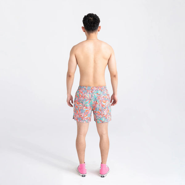Back - Model wearing Oh Buoy 2N1 Swim Volley Short 5" in Flower Pop- Multi