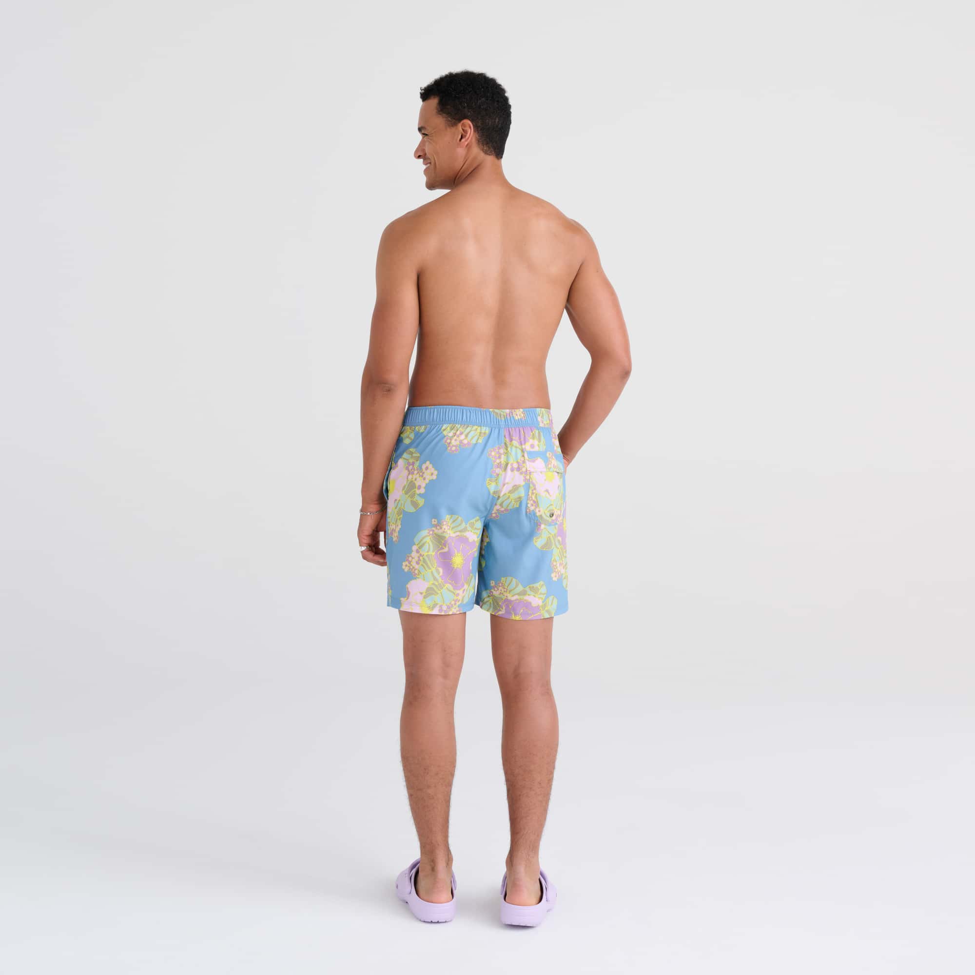 Back - Model wearing Oh Buoy 2N1 Swim Trunk 7" in Big Bloom- Washed Blue